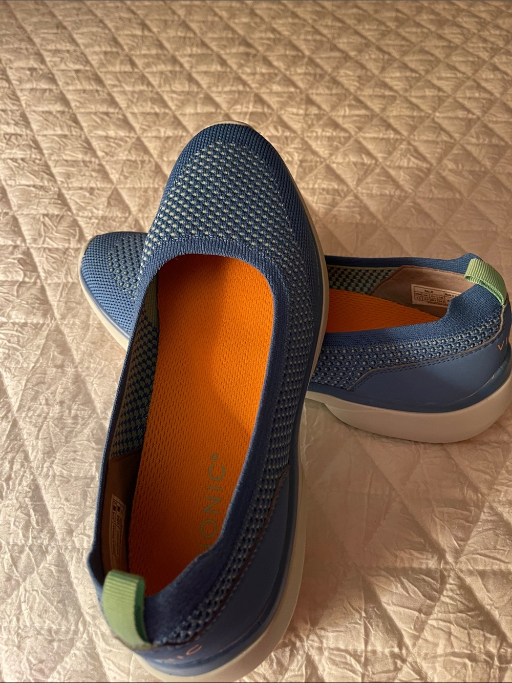 Vionic Blue Knit Slip-On Flats 
This is a vibrant blue, not a navy color.
